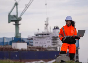 maritime worker handling ship equipment wearing safety gloves