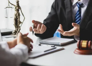 Lawyer consulting with a client to discuss legal options after a workplace accident.